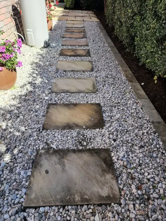 Stone stepping-stone path before pressure cleaning