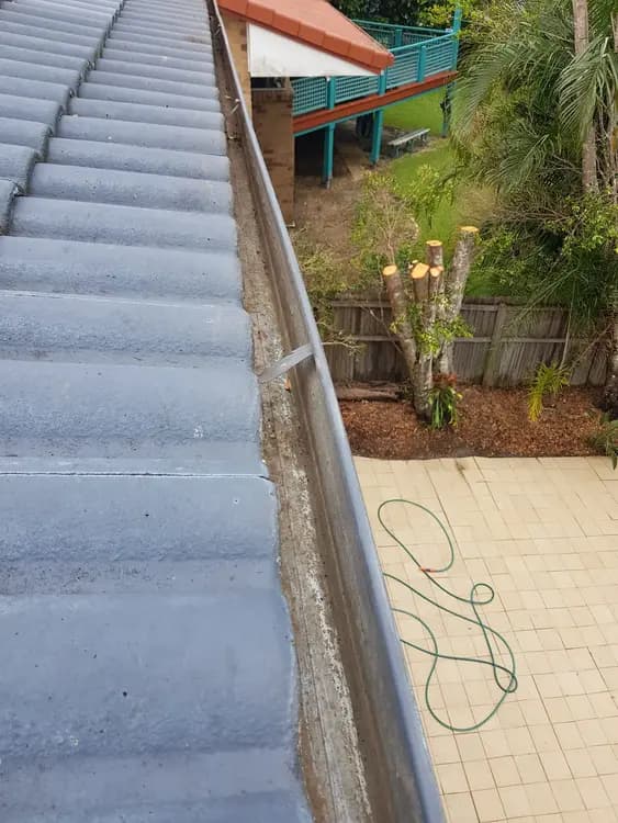 Freshly cleaned gutter on a tiled Gold Coast roof