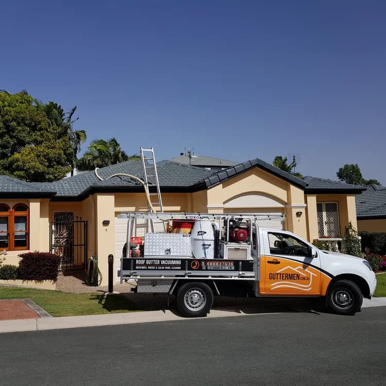 Guttermen service ute parked outside a Gold Coast home